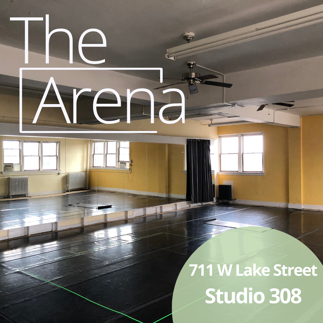 An image of the ARENA studio, with black Marley flooring and yellow walls