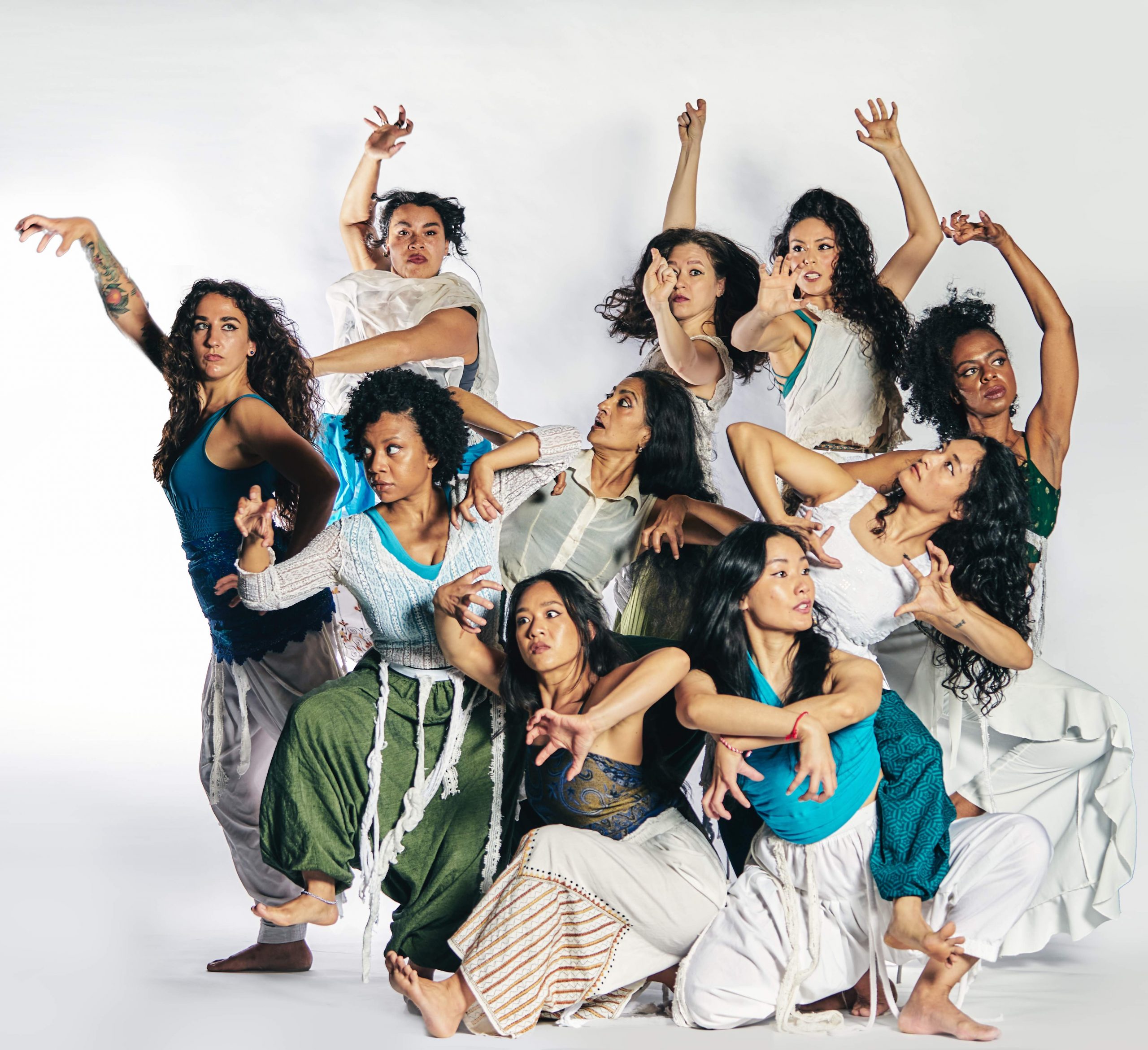 The artists of ADT, a women of color led dance company, pose with strong arms and intense faces